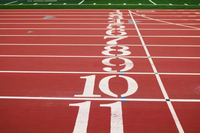 The start line of an athletic track with place numbers