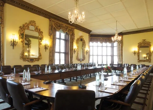 Wilton Park's conference room with a large conference table and chairs