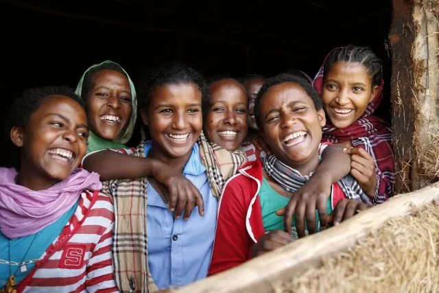 A group of young girls happy and smiling