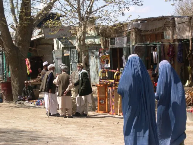 Kunduz Street with groups of people chatting
