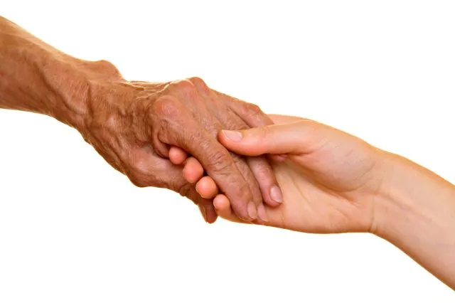 Old and young hands holding