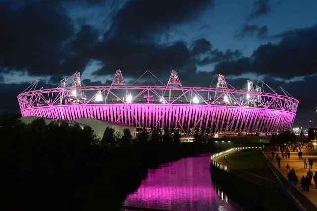 The Olympic Stadium London lit up at night