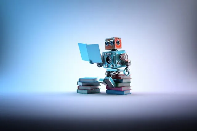 Robot sitting on a stack of books reading