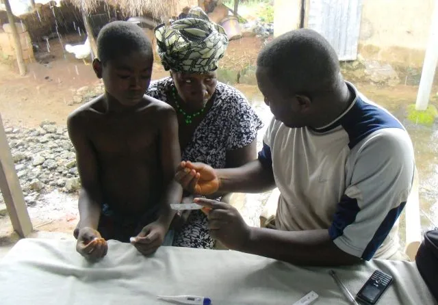 A family testing for Malaria in Guinea