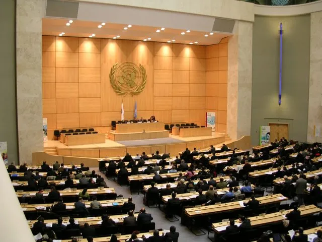 A United Nations conference room with participants