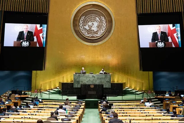 The Assembly Hall at the United Nations with Boris Johnson appearing on a large screen