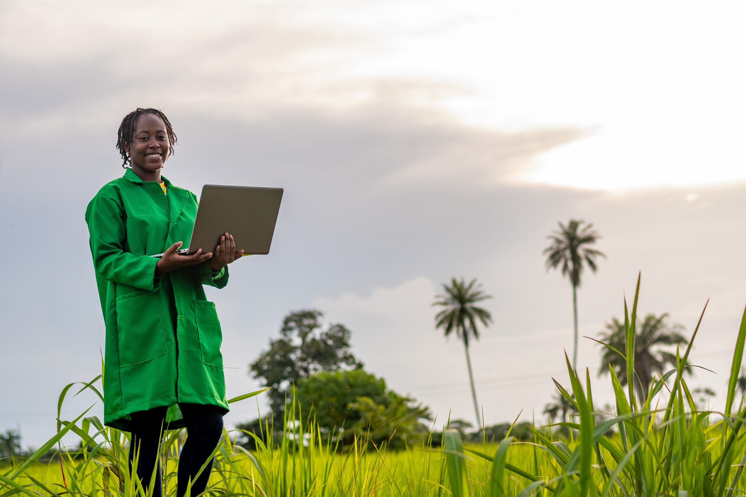 A,Shot,Of,A,Smiling,Female,African,Farmer,Using,A