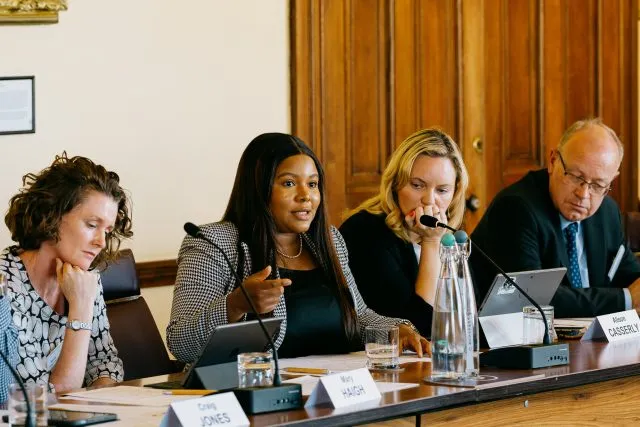 Confidence Staveley, founder and executive director of Cybersafe Foundation, speaks at the conference table