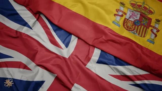 The British and Spanish flags are depicted, with a small gold bee symbolising Manchester as the meeting place for Tertulias in one corner of the British flag