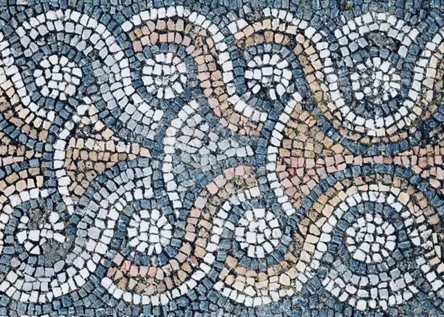 A floor with a mosaic pattern.