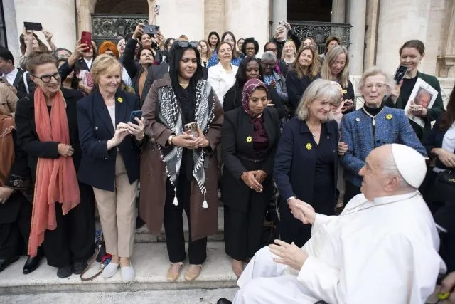 Wilton Park Programme Director Alison Hilliard shakes hands with Pope Francis.