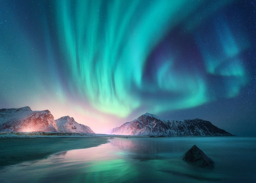 Aurora,Borealis,Over,The,Sea,,Snowy,Mountains,And,City,Lights